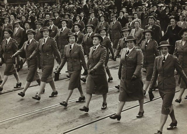 grayscale-photography-of-group-of-women-marching-on-road