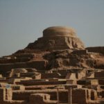 Indus Civilization - brown concrete building under blue sky during daytime