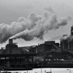 Industrial Revolution - Grayscale Photography of Locomotive Train Beside Factory
