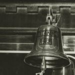 Titanic - grayscale photography of Titanic 1912 bell